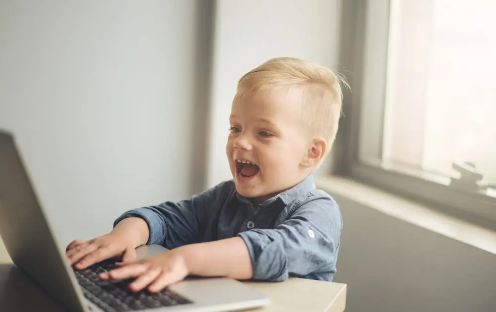Child playing on laptop