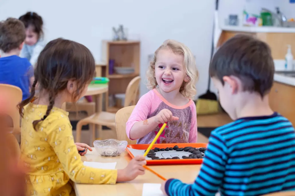 children engaged in a group activity fostering collaboration