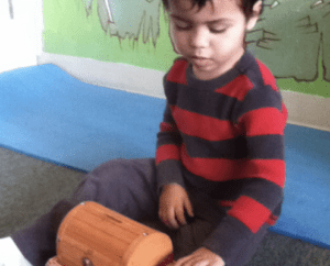 a collaborative learning activity with students and a Montessori guide